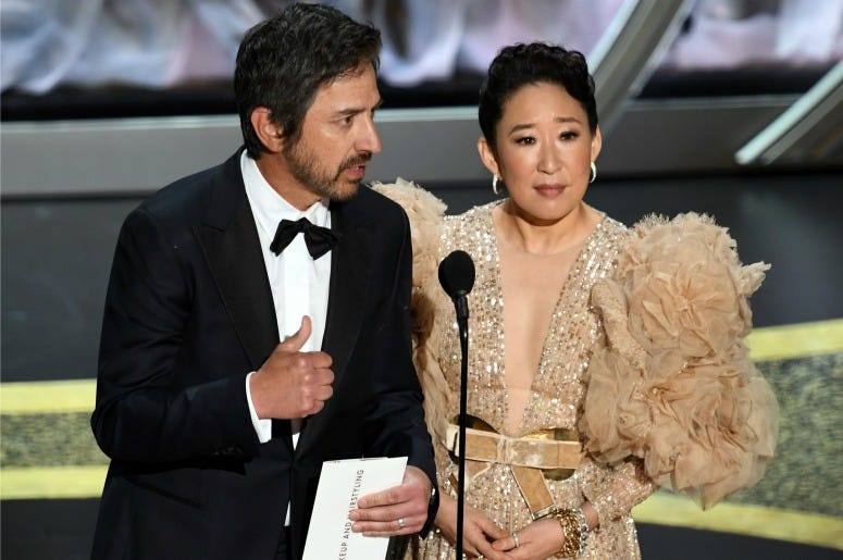 Ray Romano and Sandra Oh speak onstage during the 92nd Annual Academy Awards