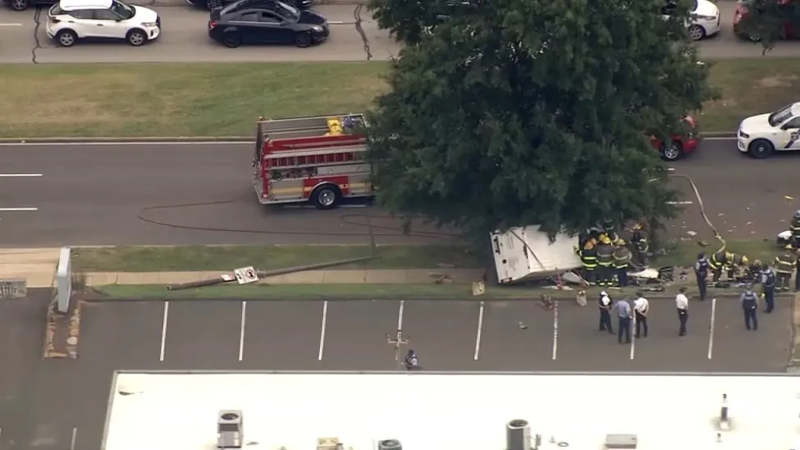 An overhead shot of the overturned van on the sidewalk along Roosevelt Boulevard.