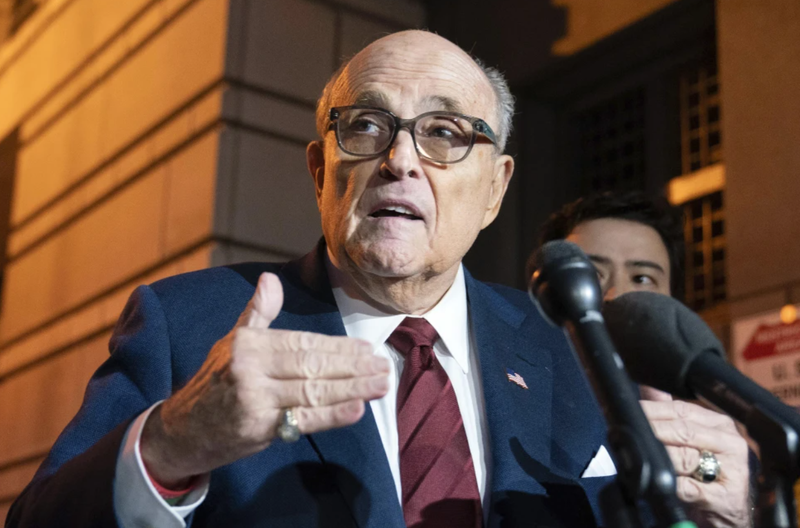 Former New York City Mayor Rudy Giuliani talks to reporters as he leaves a federal courthouse in Washington on Dec. 11, 2023. A judge threw out his bankruptcy case on Friday, July 12, 2024.