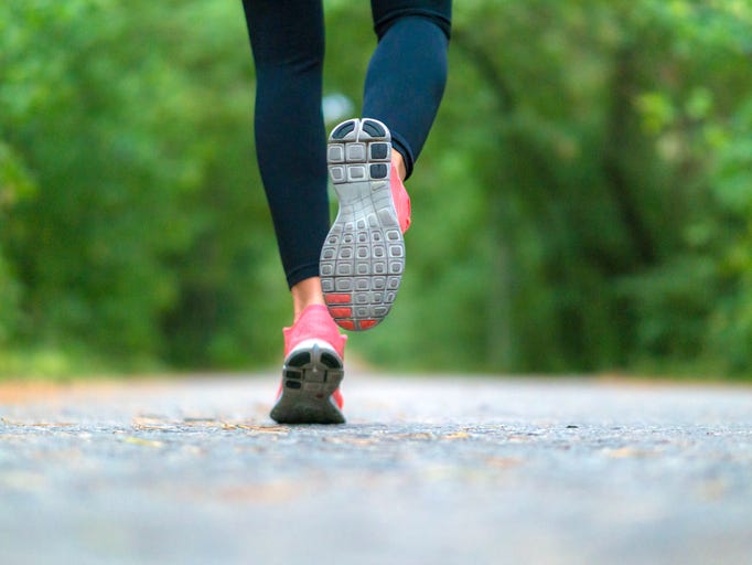 Runner on paved outdoor trail