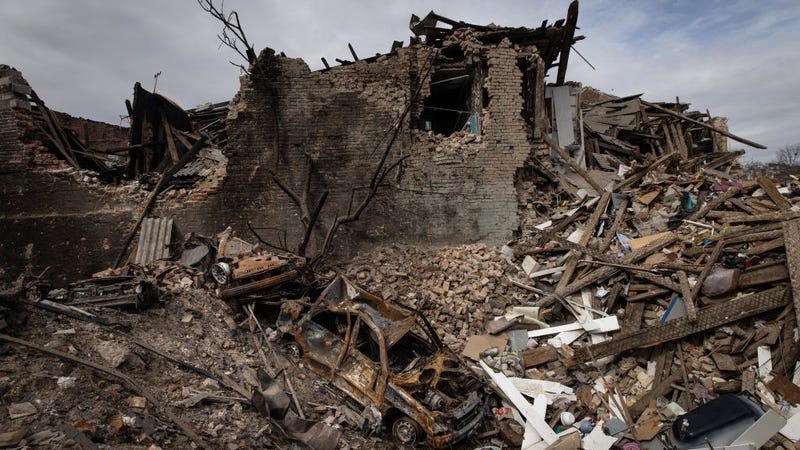 A destroyed car is seen in a crater from a Russian attack that destroyed a house approximately two weeks ago on March 28, 2022 in Kharkiv, Ukraine..