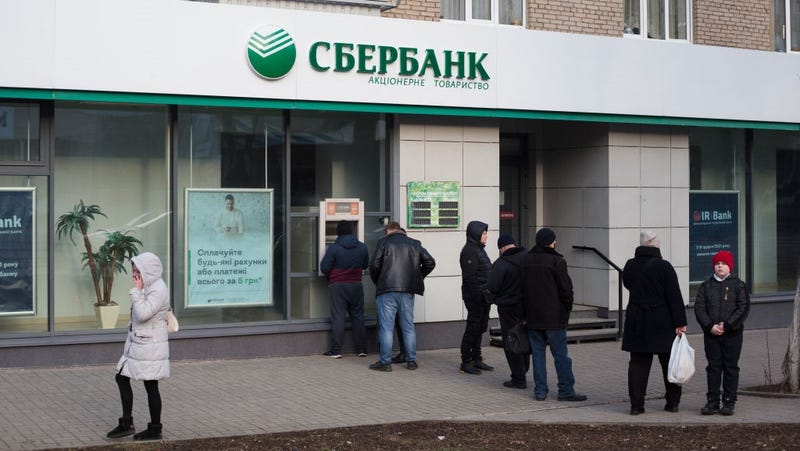 Residents wait in line at an ATM of Russian bank Sberbank on February 24, 2022 in Kramatorsk, Ukraine.