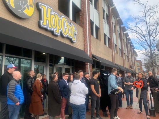 Ribbon cutting ceremony outside of new HopCat location in Royal Oak