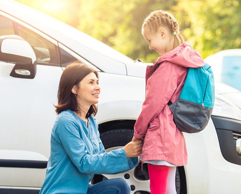 Mom dropping off kid at school 