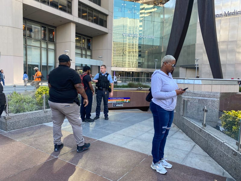 A police officer blocks the entrance to the subway near City Hall.