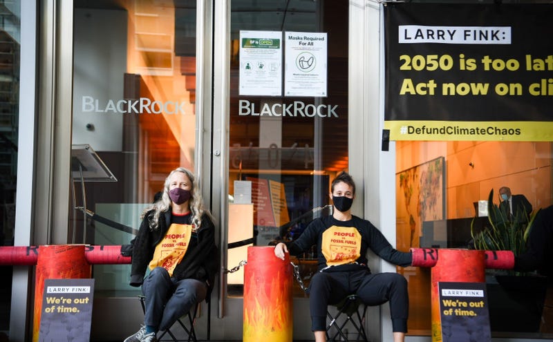 Demonstrators block the entrance to BlackRock's facility at 400 Howard St. on Friday.