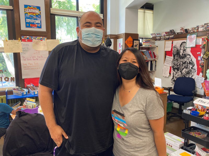 San Francisco public school teachers Vincent Reyes (L) and Cecily Ina-Lee (R) helped elderly residents in a Fillmore District apartment building evacuate their homes on Friday, according to school district officials. 