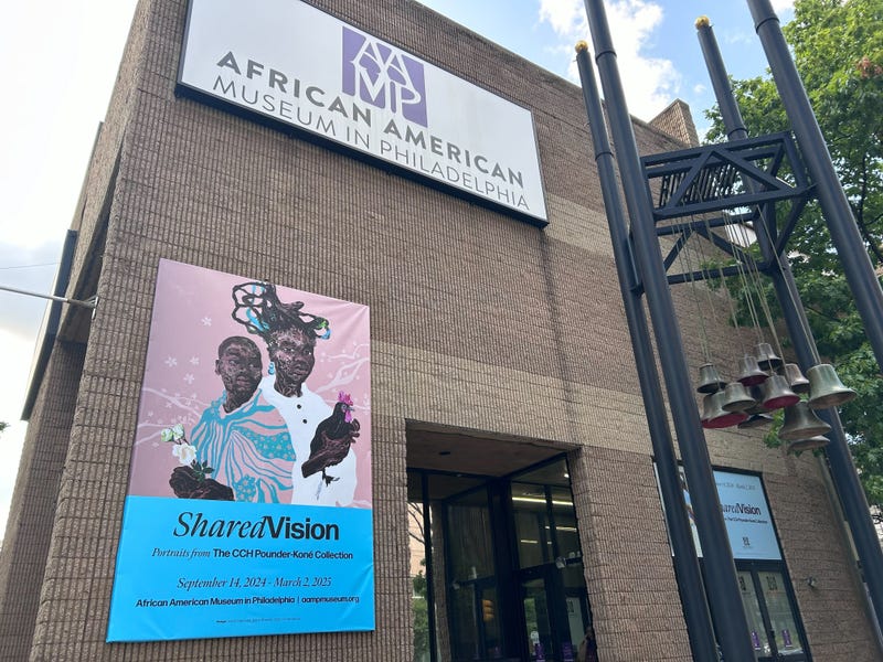 An ad for the "Shared Vision" exhibition hangs from the front of the African American Museum in Philadelphia.