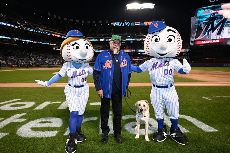 NYPD first responder, Richie Carter, and service dog, Shea at the pregame ceremony at Citi Field on Sept. 28, 2023.