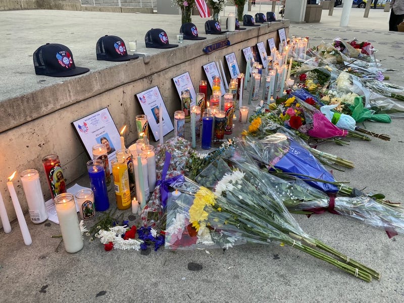 Mourners bring flowers and light candles at San Jose City Hall to remember the nine lives lost during the VTA mass shooting, May 27, 2021.