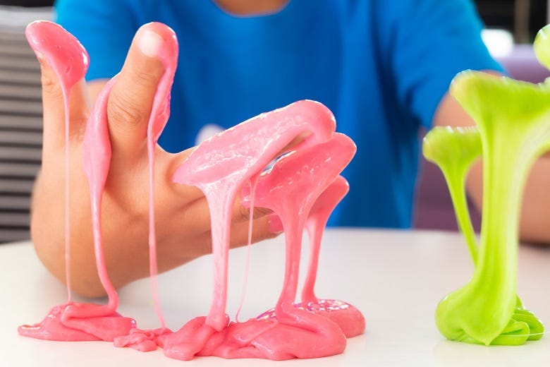 kid playing with slime 