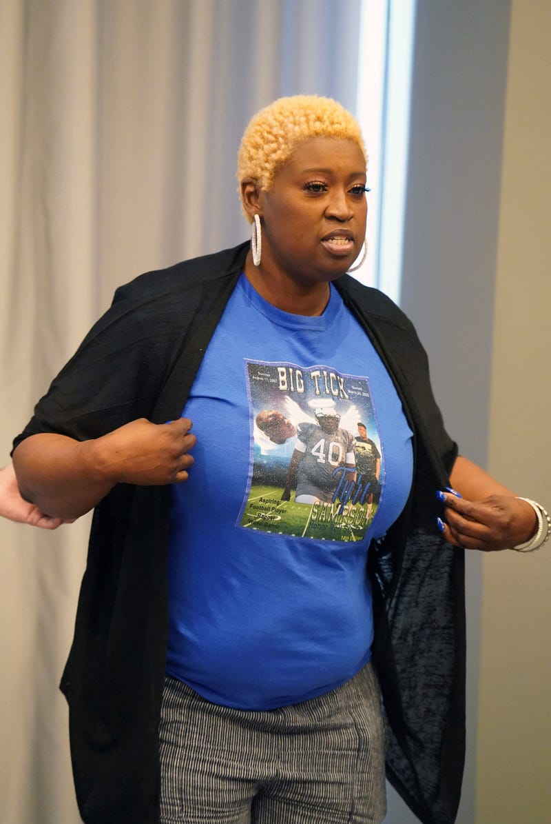 Nekia Dodd, mother of Tyre Sampson displays her tee shirt of her son, during a press conference announcing a wrongful death lawsuit filed on behalf of the family of Sampson in St. Louis on Tuesday, April 26, 2022.