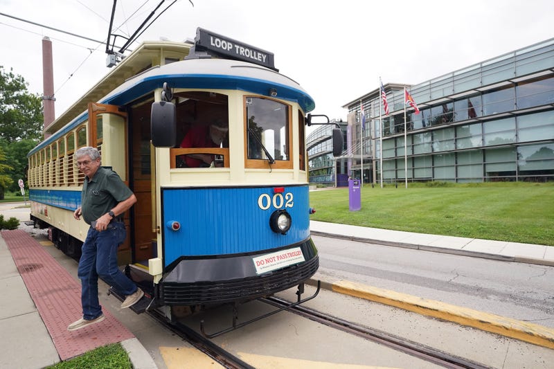 person gets off the loop trolley on delmar blvd