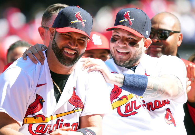 yadier molina holds albert pujols on the shoulders