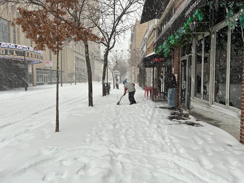 Someone shovels the sidewalk on Chestnut Street near Rittenhouse Square.