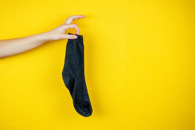 holding a single sock