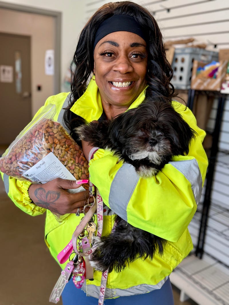 A local recipient of the SPCA's Pet Food Pantry and her dog