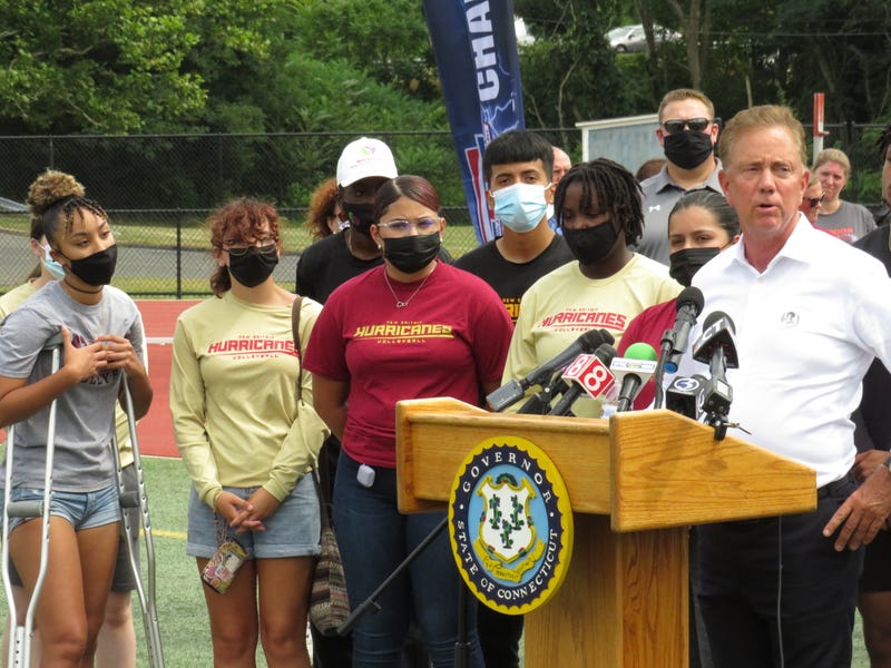 Gov. Ned Lamont and student-athletes from New Britain High School at the CIAC's "Stay in the Game" event, promoting COVID vaccination for teens, 8/17/21