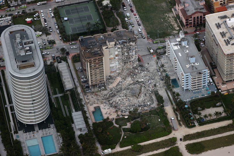 Search and rescue personnel work in the rubble of the 12-story condo tower that crumbled to the ground after a partial collapse of the building on June 24, 2021 in Surfside, Florida.