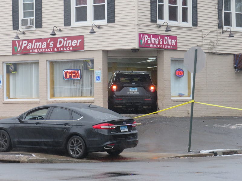 A stolen police SUV is lodged in the front entrance of Palma's Diner in Bristol, 1/12/23