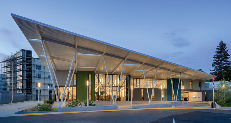 Front entrance to San Lorenzo branch of Alameda County Library pictured after sunset.