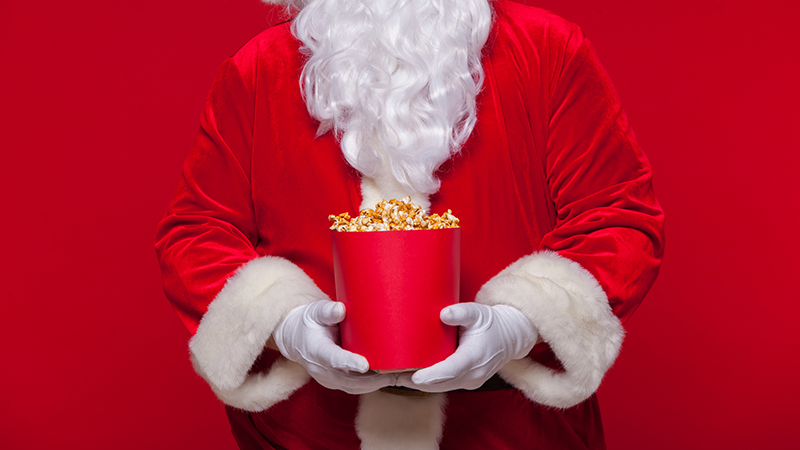 Santa holding movie popcorn