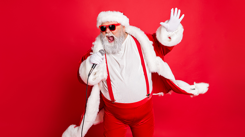 Santa singing into microphone