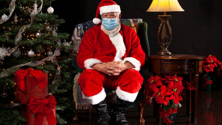 Mall Santas take on pandemic armed with plexiglass barriers, sanitation elves, and snow globe bubbles