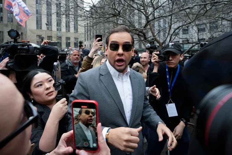 U.S. Rep. George Santos (R-NY) walks through the crowd gathered outside the courthouse on April 4, 2023.