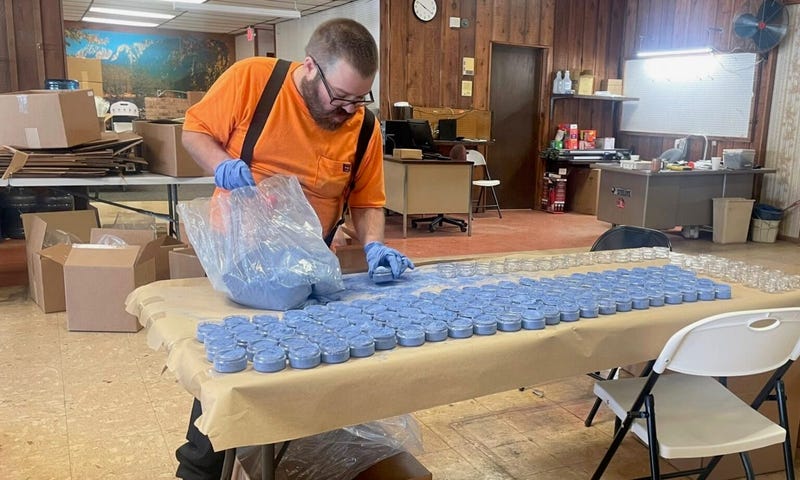 Andrew Ashelman fills jars with milk paint at Scenic River Industries Inc., a sheltered workshop in Salem. A fire destroyed the workshop’s facility in December and the future is uncertain after lawmakers did not pass a $2.5 million appropriation to help with rebuilding.