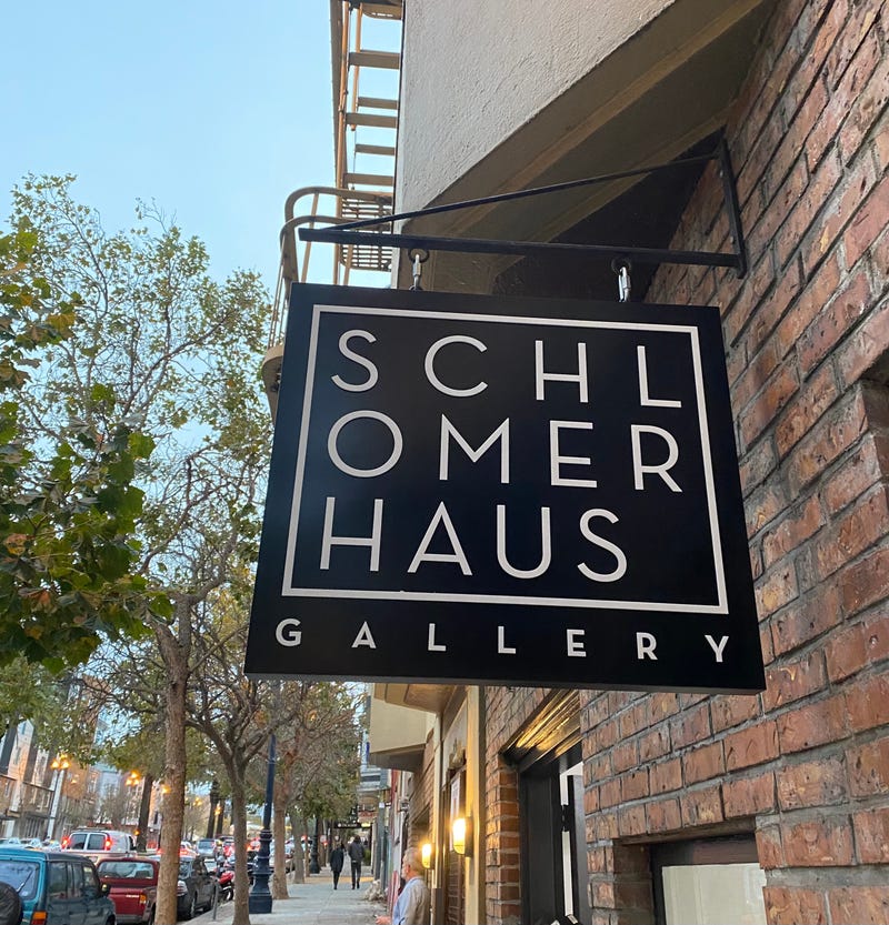 The Schlomer Haus Gallery sign at the entrance of the venue.