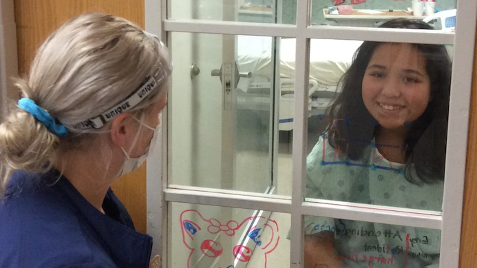 Hospitalized girl, nurse find simple way to interact during pandemic