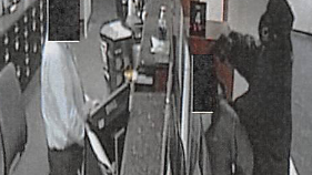Bank robber held gun to customer's head, feds say