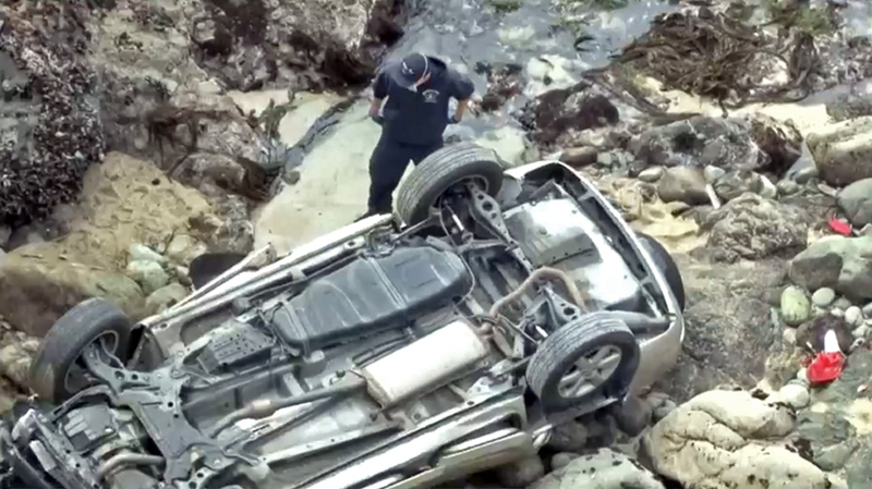 First responders examine the wreckage in near the Bodega Head Trail parking lot on Saturday.