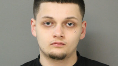 Driver pulls cop into car, crashes into fence during traffic stop: police