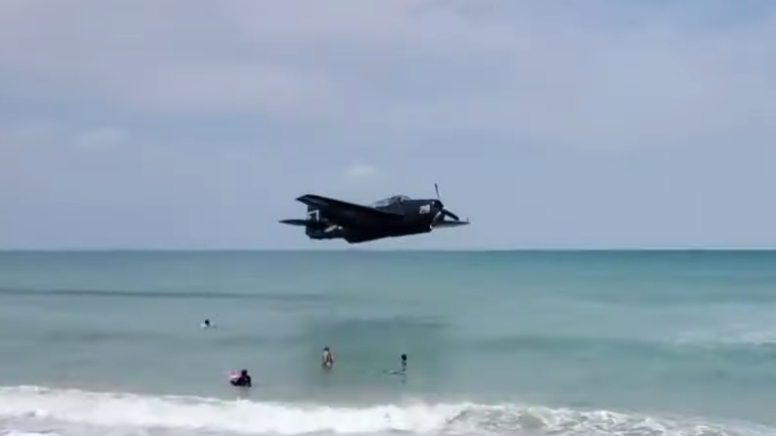 WATCH: Plane narrowly misses swimmers during emergency landing at beach