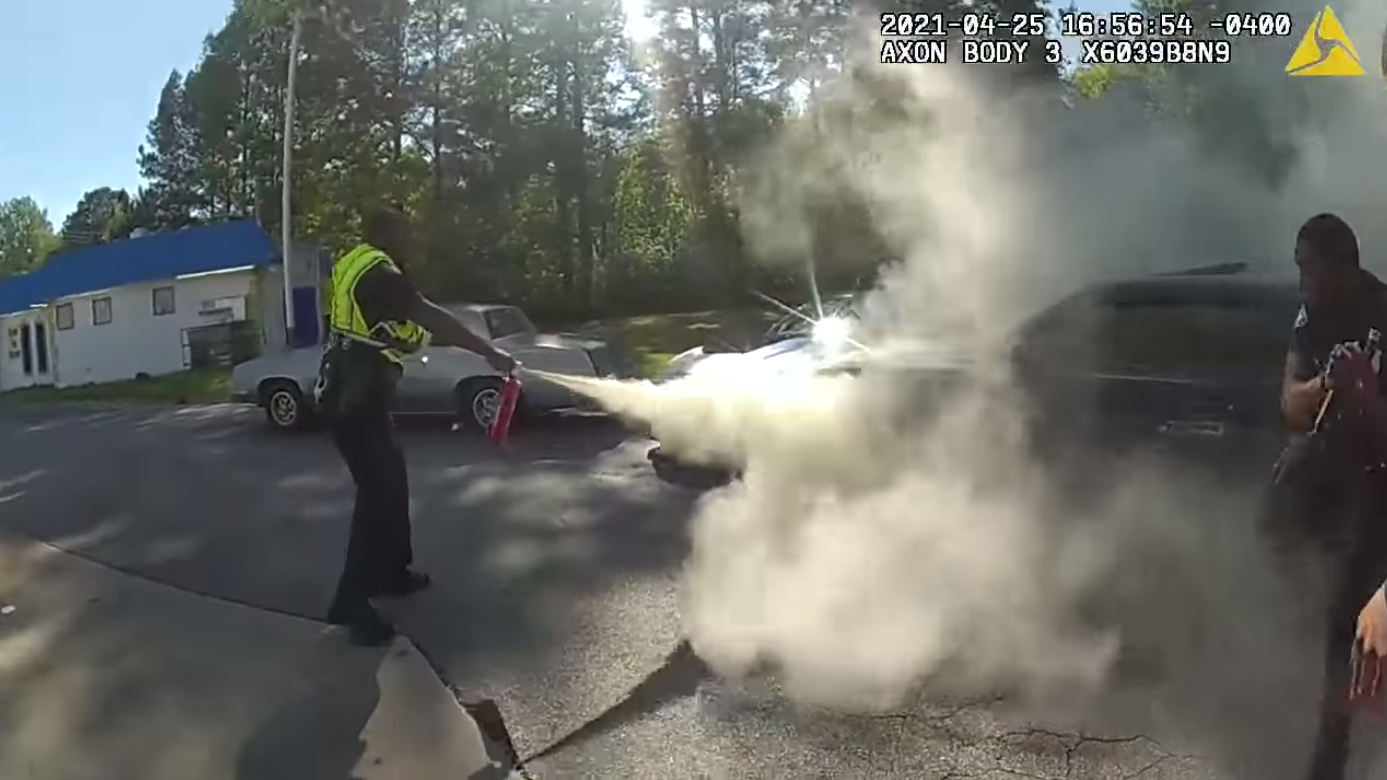 WATCH: Police rescue unconscious man from burning car