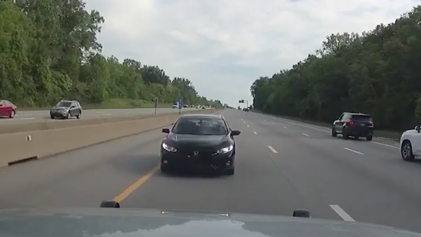 WATCH: Policeman faces a speeding wrong-way driver on busy highway