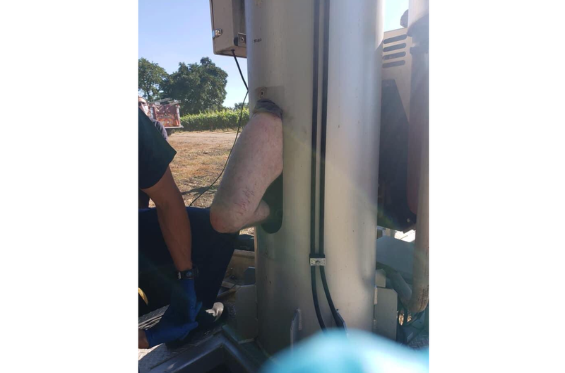 The unidentified man is shown stuck inside the shaft of a vineyard fan.