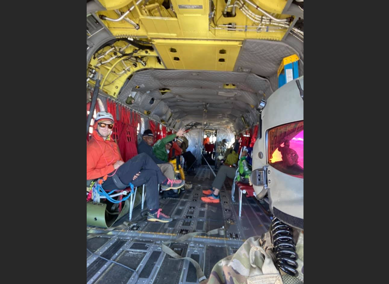The California National Guard and the three rescued three hikers stranded after they were picked up near the summit of Mt. Whitney on Tuesday morning.