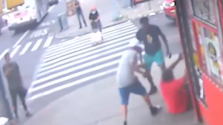 VIDEO: Man stabbed, beaten on busy Brooklyn street corner; 2 sought