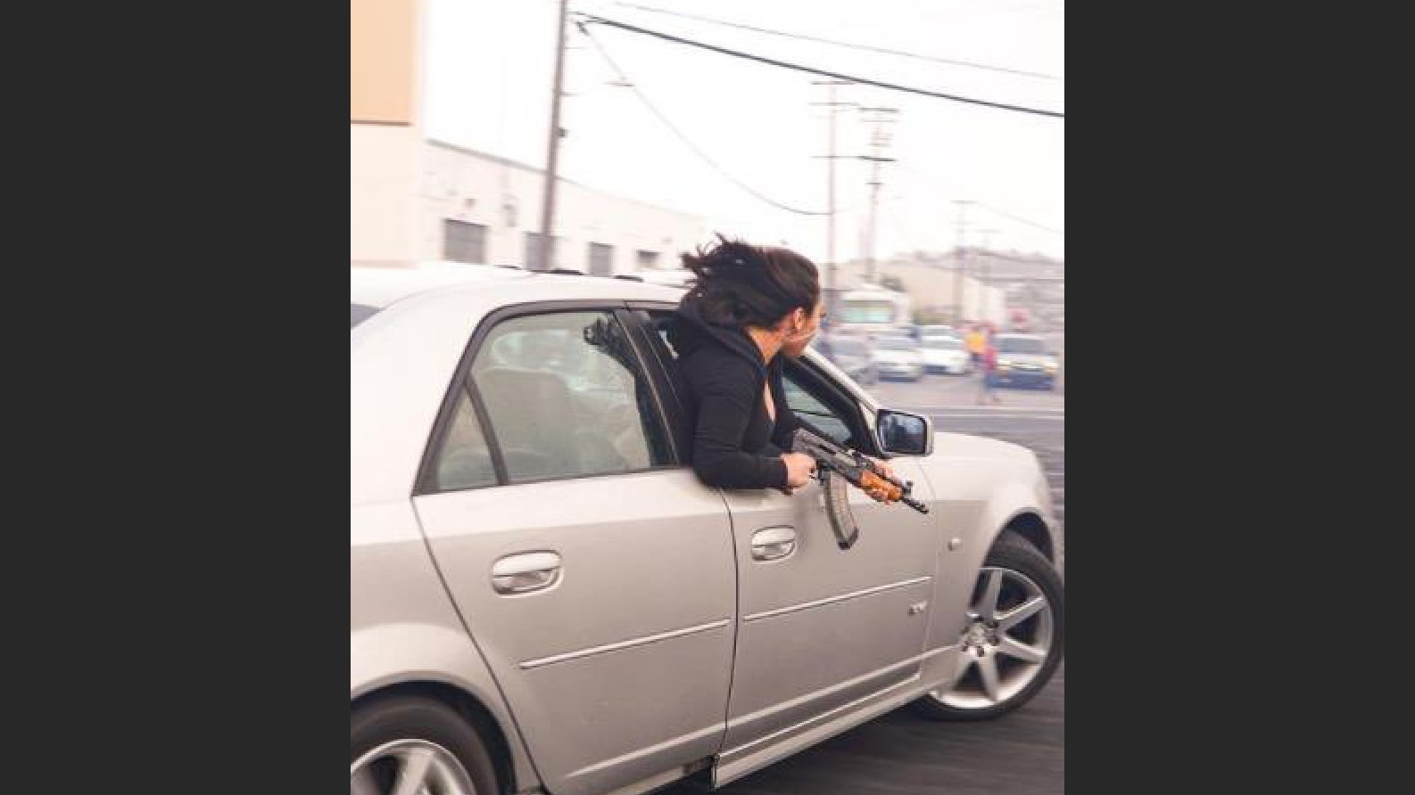 PHOTOS: Woman in SF leans out of car window brandishing AK-47