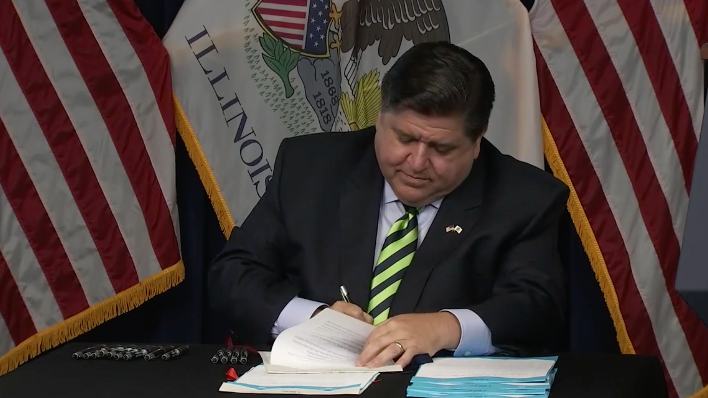 Pritzker signs 7 bills to protect domestic violence victims