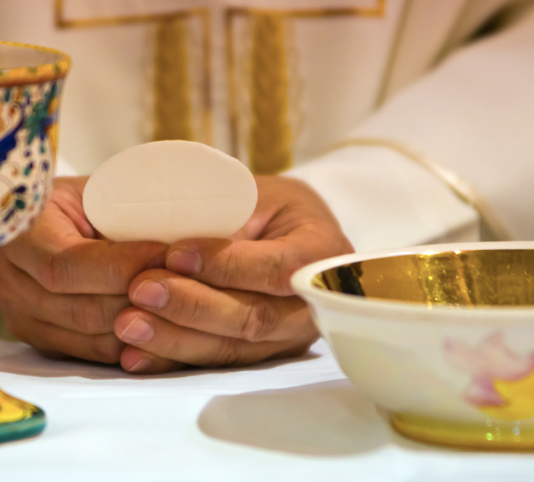 close up of communion being prepared at church