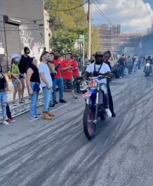 Footage of NYPD Officer Scott on the back of a dirtbike in Brooklyn.
