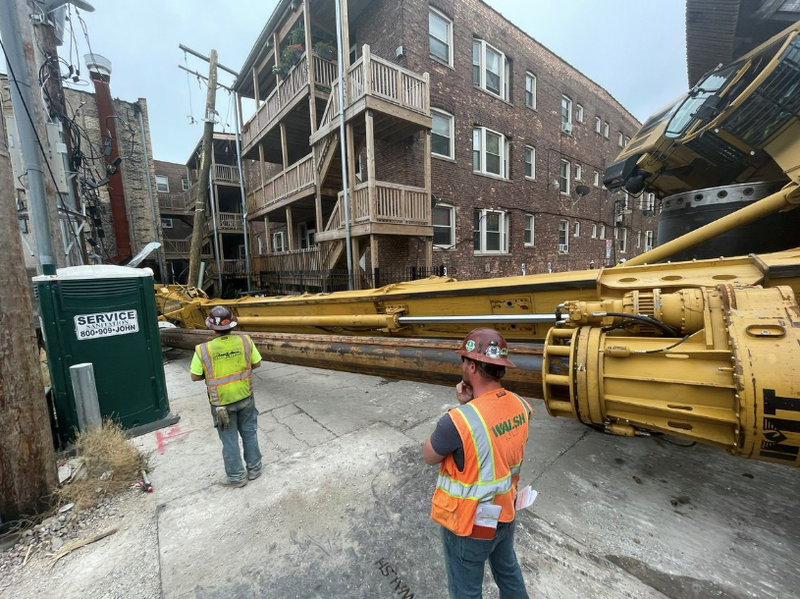 A construction crane collapsed near CTA tracks in Chicago's Edgewater neighborhood on the North Side, forcing the partial evacuation of a nearby apartment building, but causing no injuries.