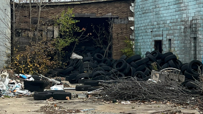 Caught in the act: Detroit police bust men for illegally dumping tires in vacant lot