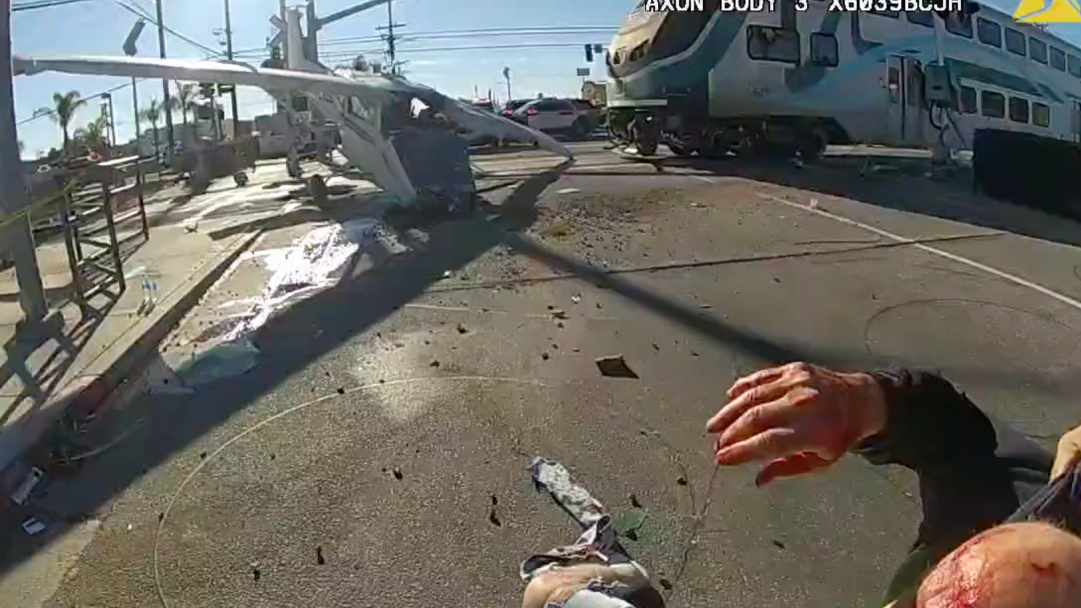 WATCH: L.A. first responders rescue pilot on train tracks before train crashes into plane