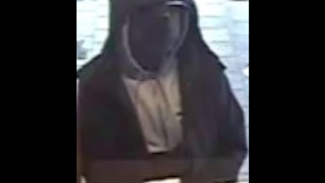 Suspect charged in 2 suburban bank robberies