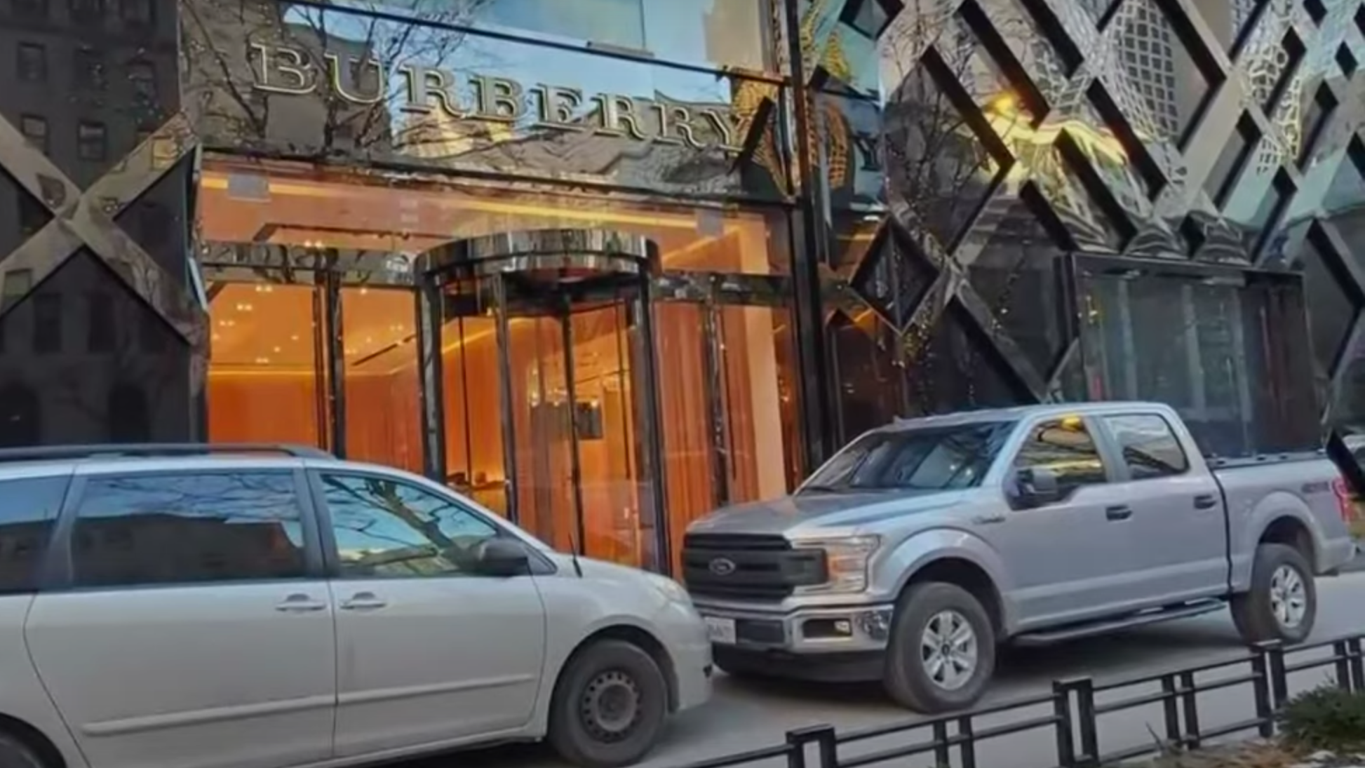 High-end Mag Mile retailer parks cars on sidewalk to prevent smash-and-grab burglaries